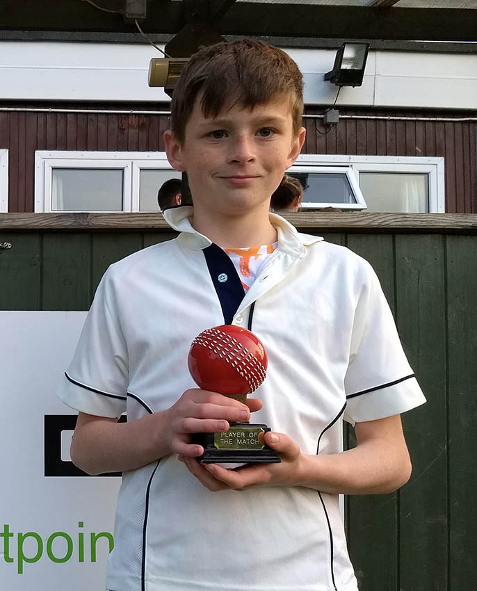 young cricketer with trophy