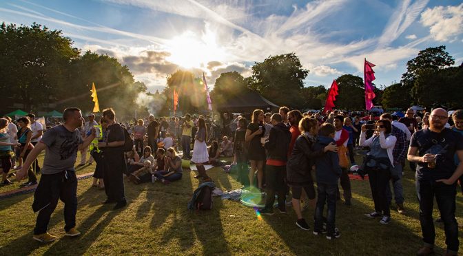 summer festival crowd in evening sunlight