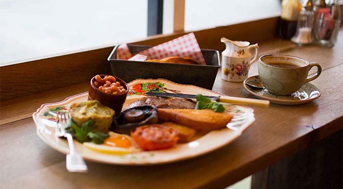 full cooked breakfast by a window 